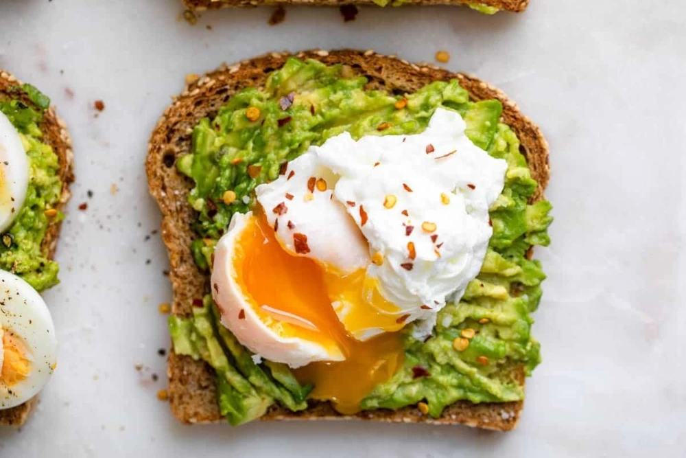 Egg & Avocado Toast accompanying Pumpkin Seeds